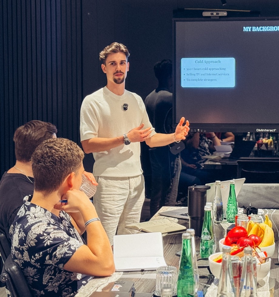 Oliver Polli presenting to a room full of people